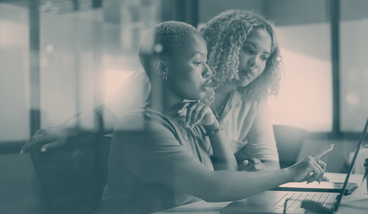 two women looking at data