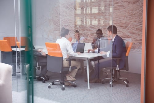 workers planning to grow their company sitting at a table